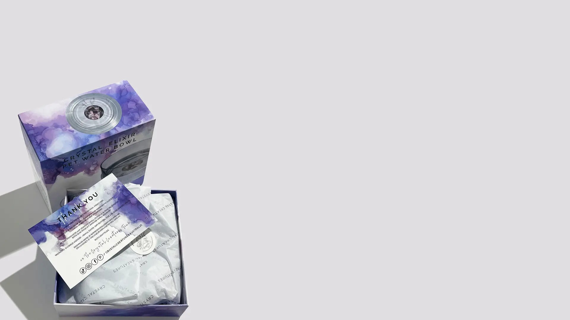 Product packaging with a purple and white design on a light gray background