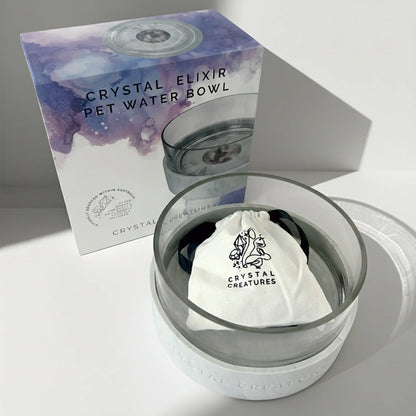 Crystal Elixir pet water bowl with packaging on a light gray background