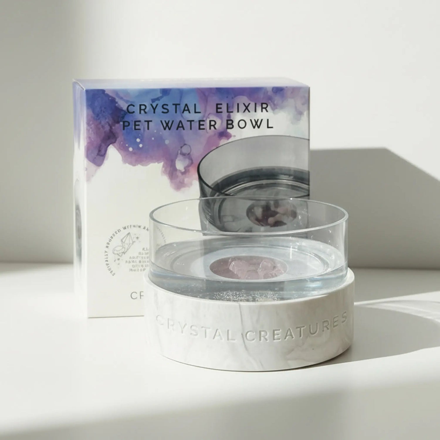 Crystal Elixir Pet Water Bowl with packaging on a white surface